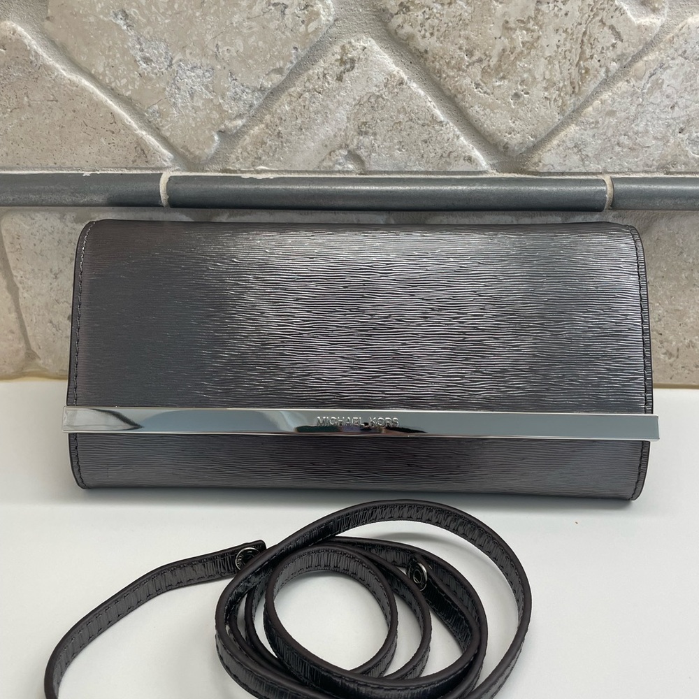 Michael Kors Metallic Silver Clutch with Strap.